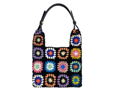 Chic black braided handbag with a colorful floral motif for women