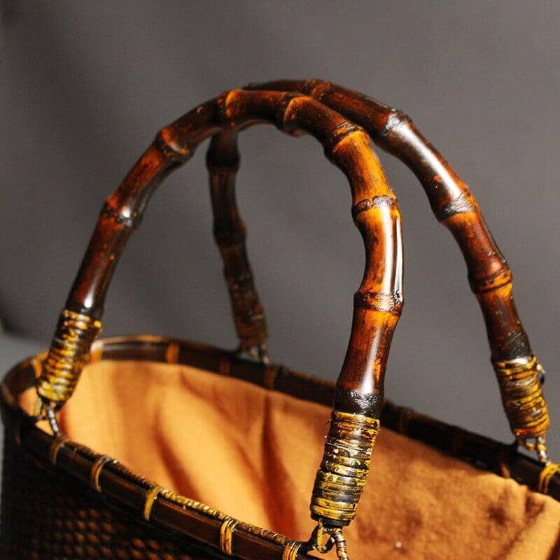 Artisanal bamboo basket bag featuring dual handles for easy carrying