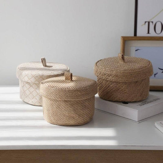 elegant storages baskets in linen over a bedroom table with sunlight
