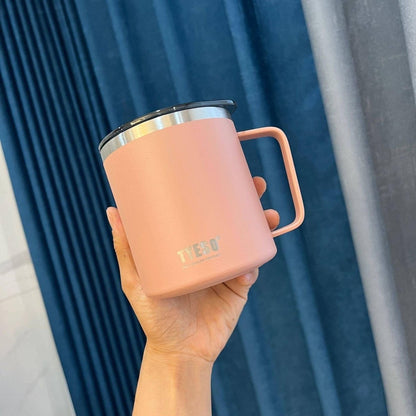 Someone holding an eco-friendly pale rose stainless steel mug