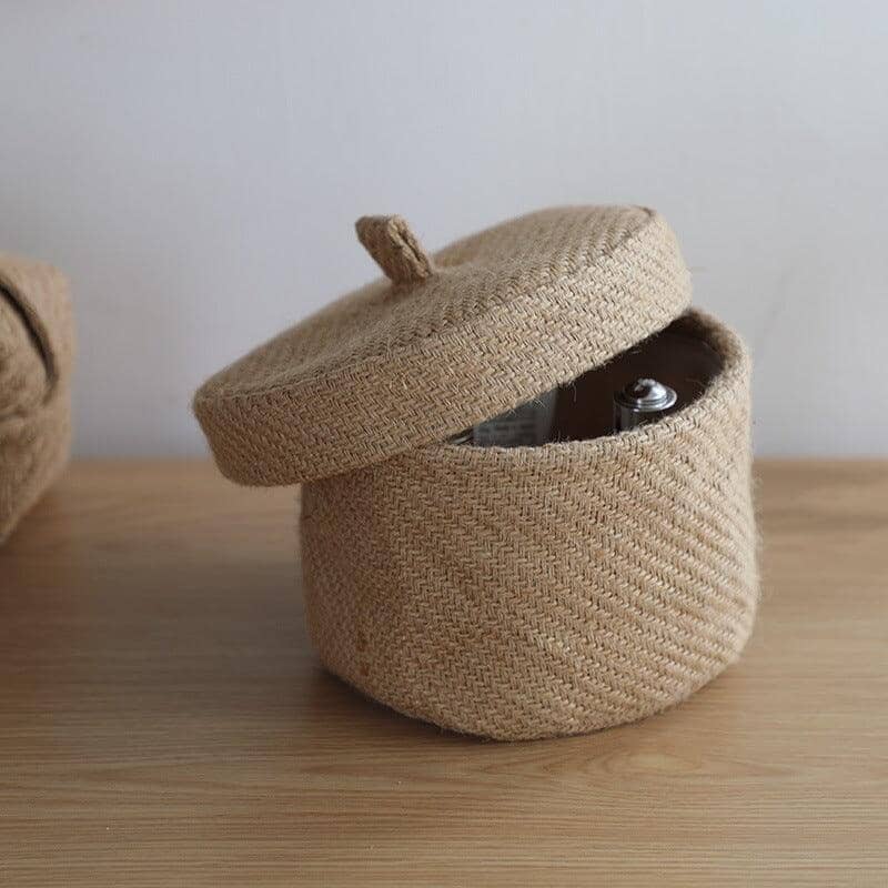 a beige linen storage basket on a wooden table