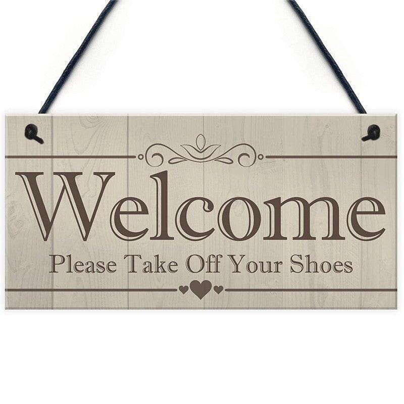 A wooden pendant plaque for home entrance decoration with message to welcome visitors