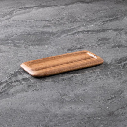 acacia wood serving try on a grey marble surface