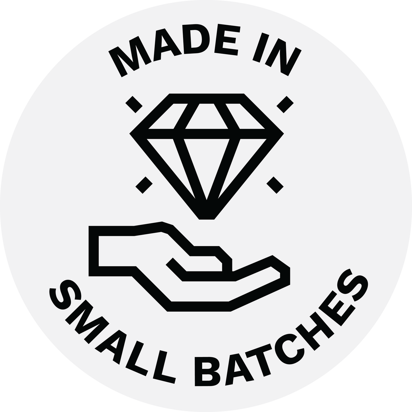 badge made in small batches with a hand holding a diamond