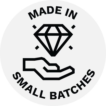 badge made in small batches with a hand holding a diamond