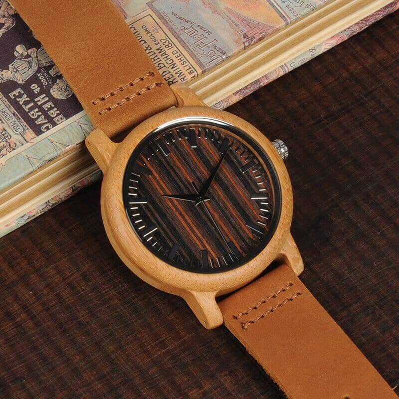 An elegant bamboo men watch with a brown wrist stripe