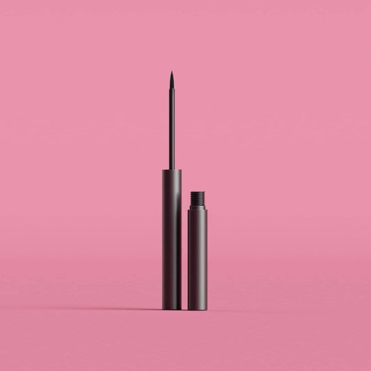 open tube of black eyeliner on a pink surface