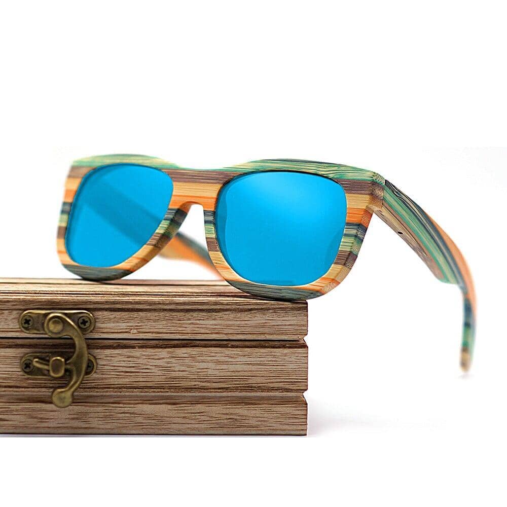 wooden box and wood glasses with blue glass glasses on a white background