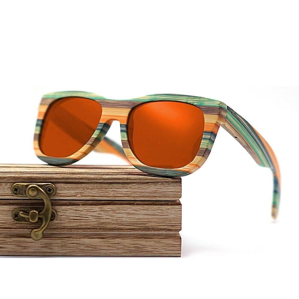 wooden box and orange color wood glasses on a white background