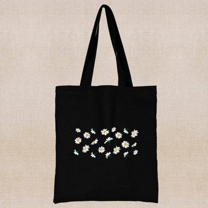 An eco-friendly and sustainable black tote bag with multiple small margaritas 