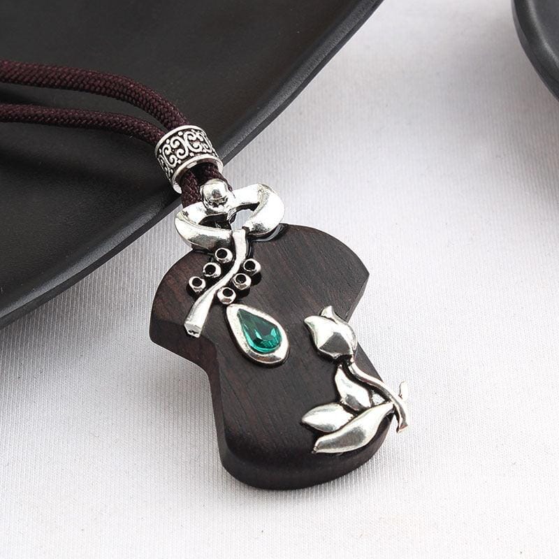 women long cotton and linen ebony wood pendant with silver floral adornements